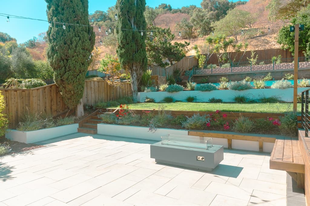 Beautiful hillside landscaping with retaining walls and terraced gardens